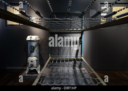 Hof, Germany. 24th Jan, 2014. A bunk bed from the border transit camp Moschendorf is on display in the Special Department 'Refugees and displaced persons' in the Museum Bayerisches Vogtland in Hof, Germany, 24 January 2014. The city of Hof presented new plans for the museum at a press conference. Photo: DAVID EBENER/dpa/Alamy Live News Stock Photo