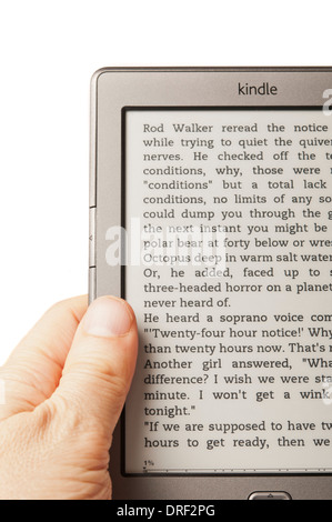 man hand holding a Kindle reader Stock Photo