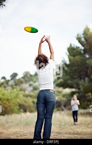 Woman Catching A Flying Disc, Croatia, Dalmatia, Europe Stock Photo