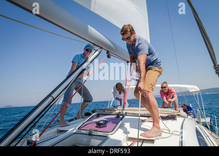 Two couples sailing together, Adriatic Sea, Croatia Stock Photo
