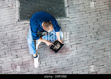 Man Using Tablet PC On Street, Osijek, Croatia Stock Photo