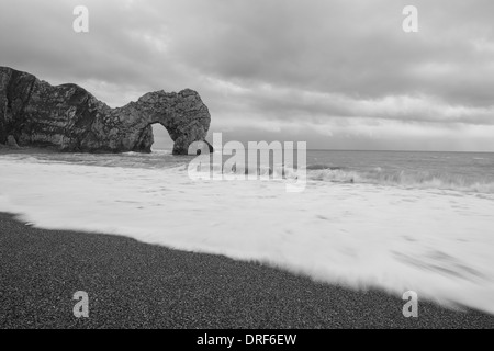 The natural limestone arch of Durdle Door on the Jurassic Coast near Lulworth in Dorset, England. Stock Photo