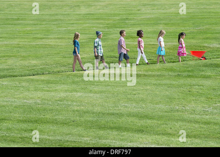 Utah USA group children walking up slope height order Stock Photo