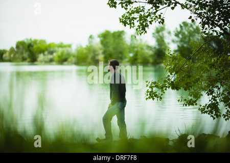 Colorado USA man standing alone looking in distance in thought Stock Photo