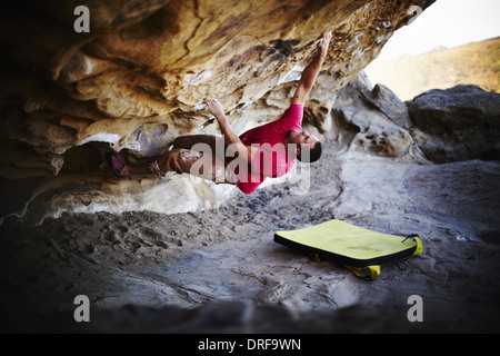 Man climbing naked on the rock Stock Photo - Alamy