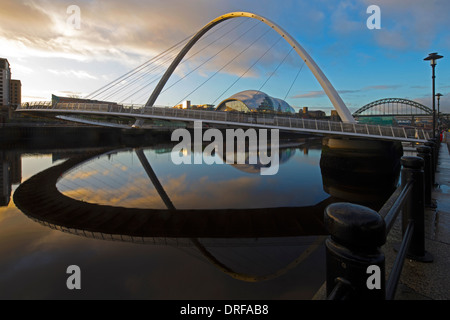 A view at dawn of The Gateshead Millennium Bridge on the River Tyne from Newcastle looking towards the Tyne Bridge