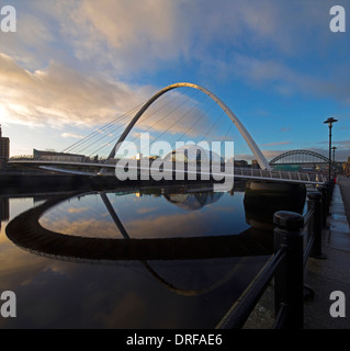A view at dawn of The Gateshead Millennium Bridge on the River Tyne from Newcastle looking towards the Tyne Bridge