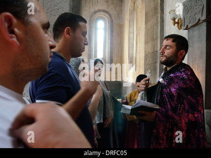 Baptism of a child in the Armenian Apostolic Church, The Cathedral of Saint Gregory the Illuminator in Goris, Armenia - Aug 2013 Stock Photo