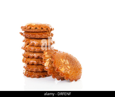 Pile of typical Dutch filled gingerbread cookies over white background Stock Photo