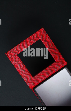 Red black rectangular ring jewellery box on dark background Stock Photo