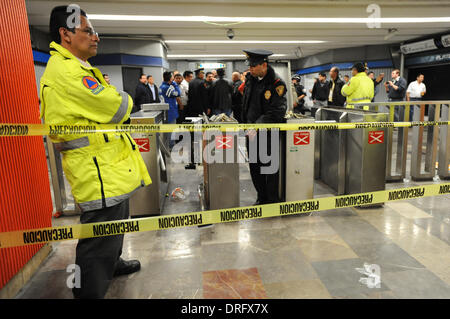 Mexico City, Mexico. 25th Jan, 2014. Police cordon off the damaged turnstiles area at Hidalgo Subway Station in Mexico City, capital of Mexico, Jan. 24, 2014. Seven people were detained for breaking the windows of a train and the turnstiles of Hidalgo Subway Station in Mexico City, according to local press. © Str/Xinhua/Alamy Live News Stock Photo