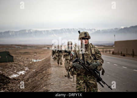 US Army soldiers with the 1st Cavalry Division conduct a patrol January 12, 2014 in Tirin Kot, Uruzgan province, Afghanistan. Stock Photo