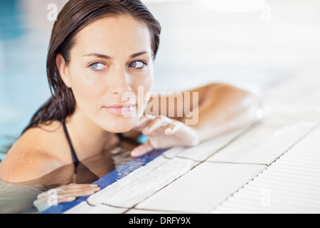 Young woman in swimming pool relaxing, Dubrovnik, Croatia Stock Photo