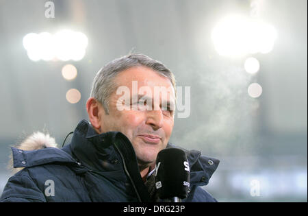 Wolfsburg, Germany. 25th Jan, 2014. Wolfsburg's sports manager Klaus Allofs smiles before the Bundesliga soccer match VfL Wolfsburg vs Hanover 96 at Volkswagen-Arena in Wolfsburg, Germany, 25 January 2014. Photo: Peter Steffen/dpa (ATTENTION: Due to the accreditation guidelines, the DFL only permits the publication and utilisation of up to 15 pictures per match on the internet and in online media during the match.)/dpa/Alamy Live News Stock Photo