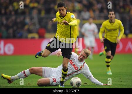 Dortmund, Germany. 25th Jan, 2014. Dortmund's Robert Lewandowski (L) vies for the ball with Augsburg's Jan-Ingwer Callsen-Bracker during the German Bundesliga soccer match between Borussia Dortmund and FC Augsburg at the SignalIdunaPark in Dortmund, Germany, 25 January 2014. Photo: MARIUS BECKER (ATTENTION: Due to the accreditation guidelines, the DFL only permits the publication and utilisation of up to 15 pictures per match on the internet and in online media during the match.)/dpa/Alamy Live News Stock Photo