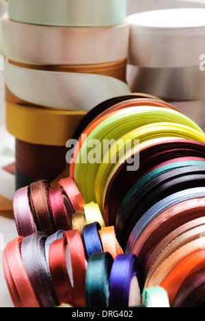 many-coloured ribbon spools in the craft Stock Photo