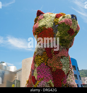 A view of 'Puppy', a floral sculpture by American artist Jeff Koons, in front of the Guggenheim Museum Bilbao in Bilbao, Spain. Stock Photo