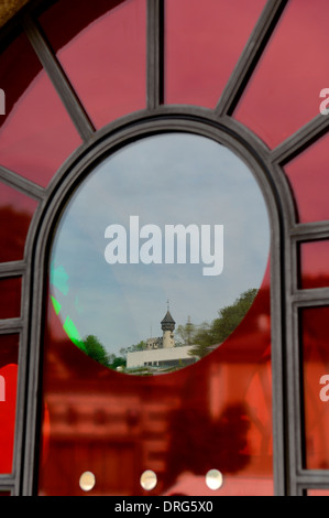 Arched window reflection of the Amalie-Redlich-Tower, Salzburg. Austria Stock Photo