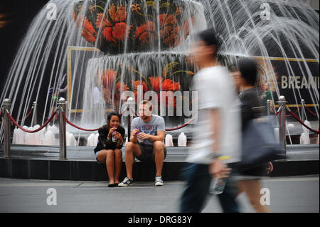 Jan. 25, 2014 - Kuala Lumpur, Malaysia - Tourists takes a break in front of a fountain in a shopping mall outside Kuala Lumpur, Malaysia, Saturday, January 25, 2014. (Credit Image: © Joshua Paul/NurPhoto/ZUMAPRESS.com) Stock Photo