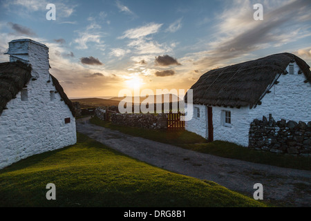 Crofts at sunset, Cregneash National Folk Museum looking towards the Calf of Man, Isle of Man Stock Photo