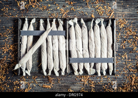 Closeup of metal cigarette cases with cigarettes Stock Photo