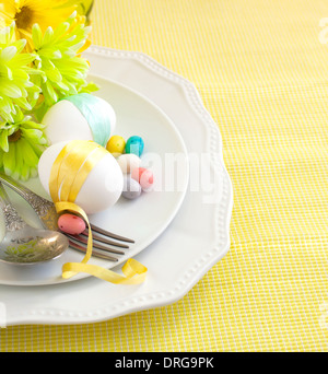 Easter table setting with flowers and eggs Stock Photo