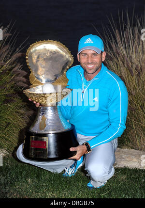 Doha, Qatar. 25th Jan, 2014. Sergio Garcia of Spain holds the winner's trophy after the final round of the Commercial Bank Qatar Masters at the Doha Golf Club in Doha, Qatar, Jan. 25, 2014. Garcia claimed the title after he birdied the third extra hole to beat Finland's Mikko Ilonen in a playoff. Credit:  Chen Shaojin/Xinhua/Alamy Live News Stock Photo