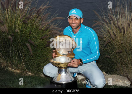 Doha, Qatar. 25th Jan, 2014. Sergio Garcia of Spain holds the winner's trophy after the final round of the Commercial Bank Qatar Masters at the Doha Golf Club in Doha, Qatar, Jan. 25, 2014. Garcia claimed the title after he birdied the third extra hole to beat Finland's Mikko Ilonen in a playoff. Credit:  Chen Shaojin/Xinhua/Alamy Live News Stock Photo