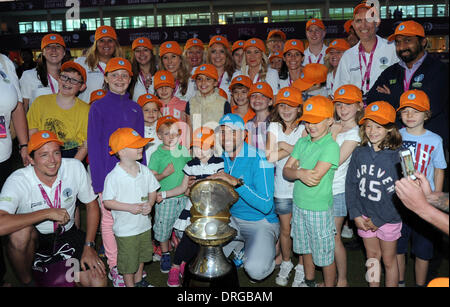 Doha, Qatar. 25th Jan, 2014. Sergio Garcia of Spain holds the winner's trophy with fans after the final round of the Commercial Bank Qatar Masters at the Doha Golf Club in Doha, Qatar, Jan. 25, 2014. Garcia claimed the title after he birdied the third extra hole to beat Finland's Mikko Ilonen in a playoff. Credit:  Chen Shaojin/Xinhua/Alamy Live News Stock Photo