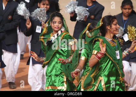 Gandhi Maidan, Patna, Bihar, India, 26th January 2014. Cheerful young Bihari dancers perform on the occasion of 65th Republic Day parade of India. The Republic Day Parade starts early winter morning in a full packed parade ground attended by top Bihar Government Officials, addressed by Dr. Dnyandeo Yashwantrao Patil, Governor of Bihar and Shri Nitish Kumar, Chief Minister of Bihar.  Total 12 tableaus joined the march past accompanied by cheerful dancing young boys and girls who made the event memorable one. 17 Police Officers were also awarded President’s medal at the ceremony. Stock Photo