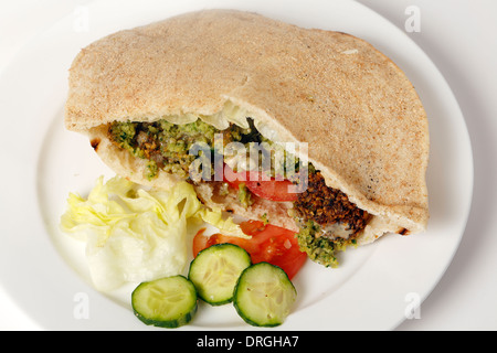 Egyptian flat bread stuffed with salad and falafels, a traditional fast food in the Middle East Stock Photo