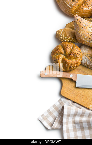 various breads with cutting board and knife on white wooden background Stock Photo