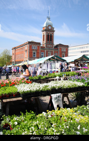 Chesterfield outdoor market looking towards the clock tower of the town's Market Hall in summer, Chesterfield, Derbyshire, UK Stock Photo