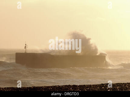 Hastings, East Sussex, UK. 26th Jan, 2014. Waves crash over the breakwater off Hastings Old Town beach as wind increases to gale force. Credit:  David Burr/Alamy Live News Stock Photo