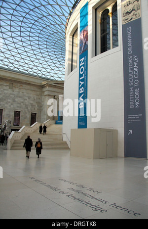 Visitors in the  'Queen Elizabeth II Great Court' with the Reading Room at its centre in the British Museum, London, England, UK Stock Photo