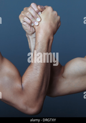 Two hands doing arm wrestling Stock Photo