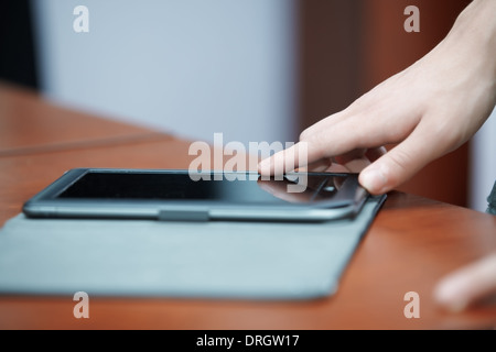Human hand using tablet computer Stock Photo