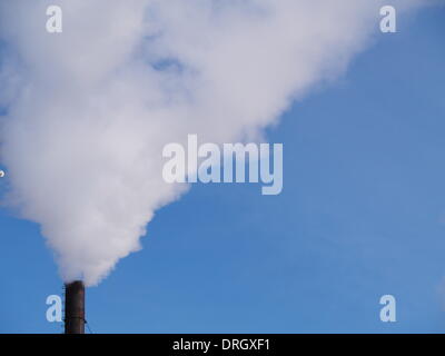 Lugansk, Ukraine. 26th Jan, 2014. smoke pipe against clear blue sky.   Tonight frosts in eastern Ukraine reached -29 degrees Celsius. In the coming days is expected a slight warming. Credit:  Igor Golovnov/Alamy Live News Stock Photo