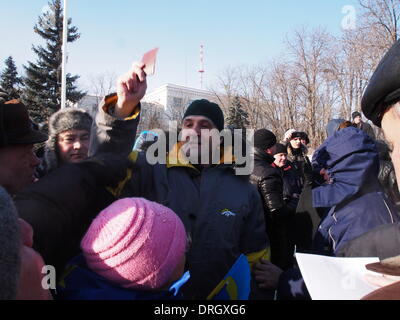 Lugansk, Ukraine. 26th Jan, 2014. Provocateur demonstrates passport, allegedly confirming that he resident Lugansk. Ukraine passports have different color. Credit:  Igor Golovnov/Alamy Live News Stock Photo
