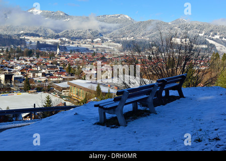 Above Oberstdorf in the Allgäu in winter with a snow fall  looking down upon the town, Bavaria, Germany Stock Photo