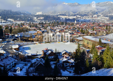 Above Oberstdorf in the Allgäu in winter with a snow fall  looking down upon the town, Bavaria, Germany Stock Photo