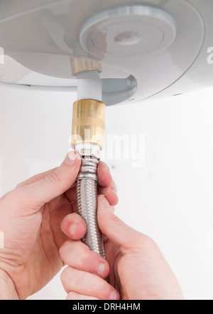 Safety valve for electric water heater. Dusty piping of a domestic hot  water system. Plumbing work. Side view. Selective focus. Close-up Stock  Photo - Alamy
