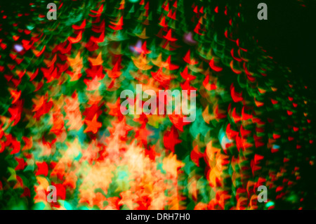 Colorful abstract star-shaped Christmas lights abstract blurred background Stock Photo