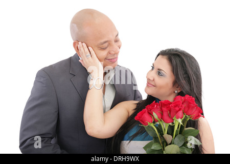 Happy woman receiving a bouquet of red roses of her lover Stock Photo