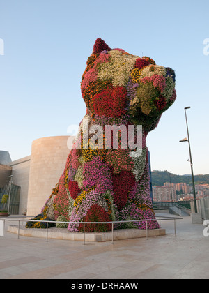 A view of 'Puppy', a floral sculpture by American artist Jeff Koons, in front of the Guggenheim Museum Bilbao in Bilbao, Spain. Stock Photo