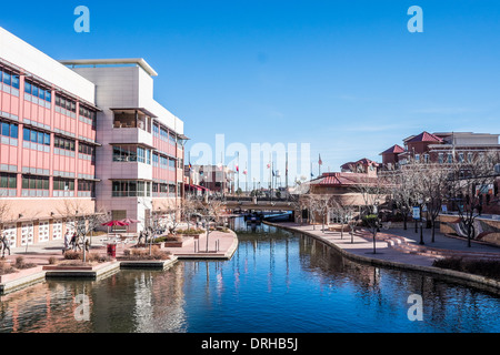 RiverWalk in historic old town of Pueblo, Colorado. Professional Bull Rider's Association building on the left. Stock Photo