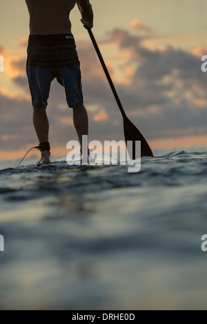 Hawaii Honolulu SUP Stand up Paddle board Waikiki Beach board ocean sport paddle winter [Brad Osborn] sunset Stock Photo