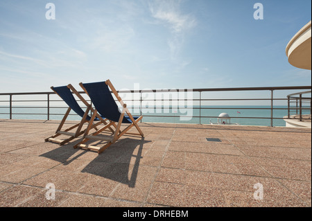 Couple of empty deck chairs fantastic ocean English channel view from  De La Warr Pavilion Stock Photo
