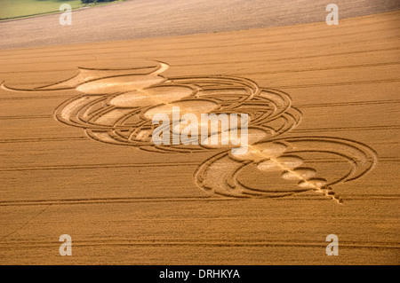 Crop circles in wheat fields near Alton Barnes,Wiltshire.These creations flatten the crops to make interesting patterns. Stock Photo