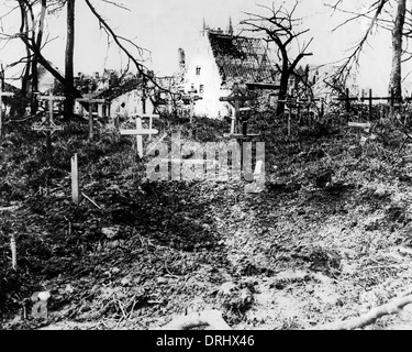 Shell crater in Flanders graveyard, Western Front, WW1 Stock Photo